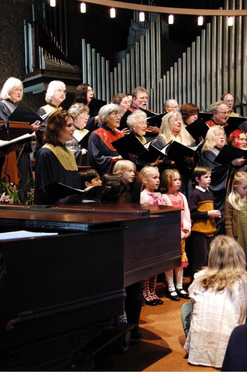 people of all ages singing in a choir